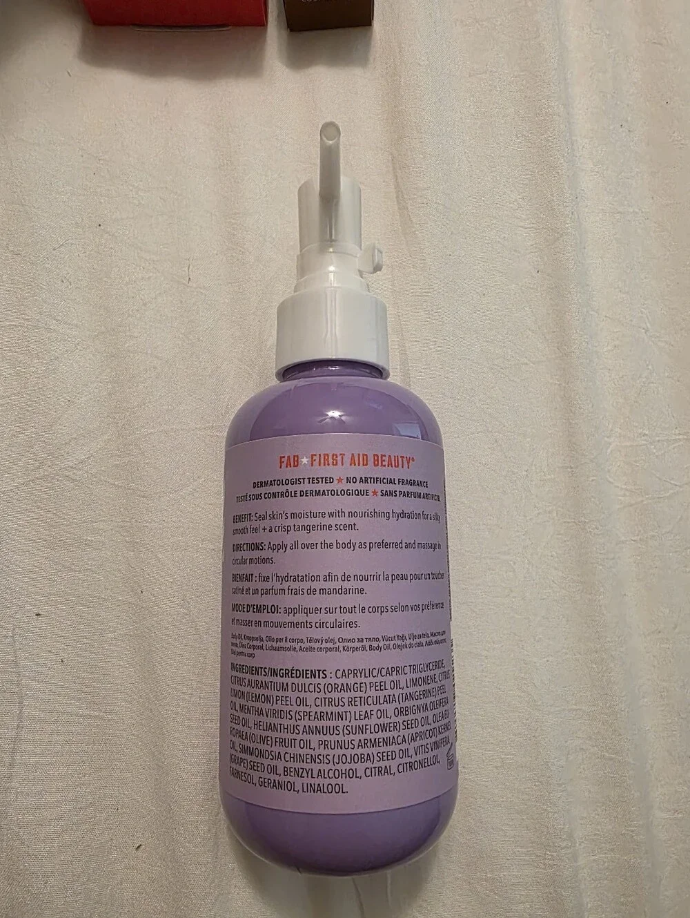 First Aid Beauty Lavender After-Shower Nourishing Body Oil - Purple Bottle